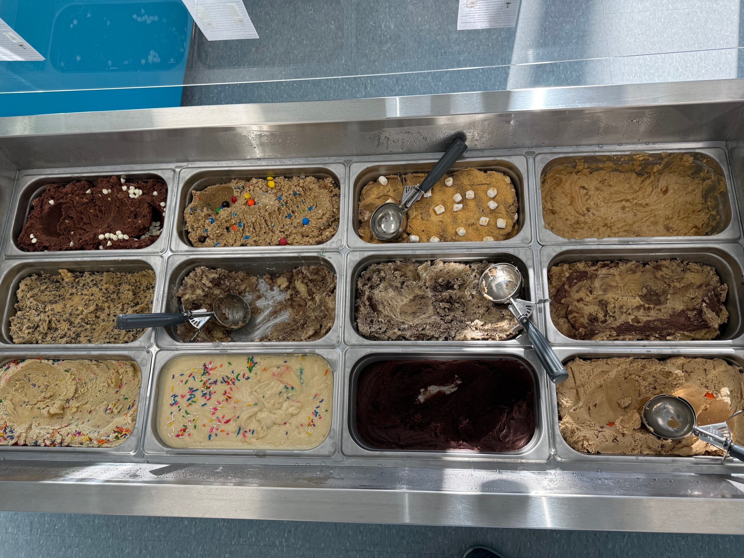 Picture of different edible cookie dough flavors at the Doughzerts retail location.
