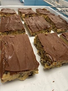 A picture of chocolate chip cookie dough bars inside the merchandising case.